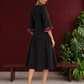 Classic Black Cotton A-line Dress with Contrast Maroon Ikat Collar and Matching Sleeve Cuffs — back view