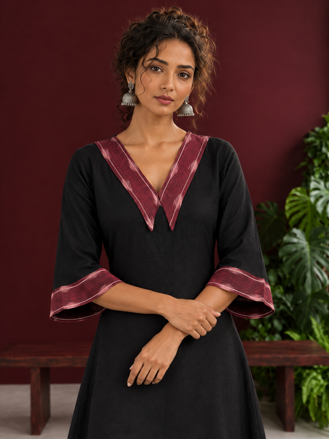 Classic Black Cotton A-line Dress with Contrast Maroon Ikat Collar and Matching Sleeve Cuffs — styled view