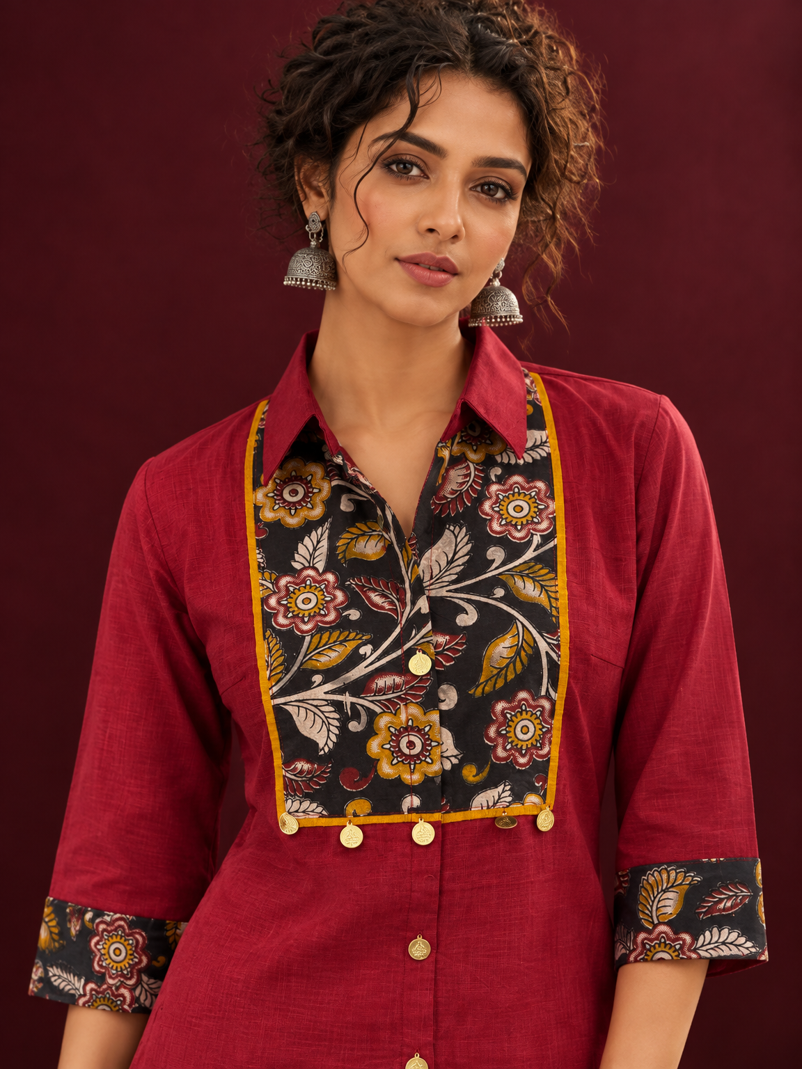 Maroon Cotton Shirt with Contrast Kalamkari Printed Yoke Panel & Sleeve Cuffs with Gold Button Detailing — fabric detail
