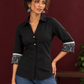 Classic Black Cotton Shirt with Collared Neckline and Contrast Printed Sleeve Cuffs — fabric detail