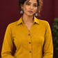 Mustard Yellow Cotton Shirt with Contrast Green Ikat Border Hem and Buttons — fabric detail