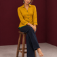 Mustard Yellow Cotton Shirt with Contrast Green Ikat Border Hem and Buttons — seated