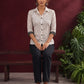 Classic White Cotton Shirt with Black Polka Dot Print and Contrast Lace Cuff Detail — seated