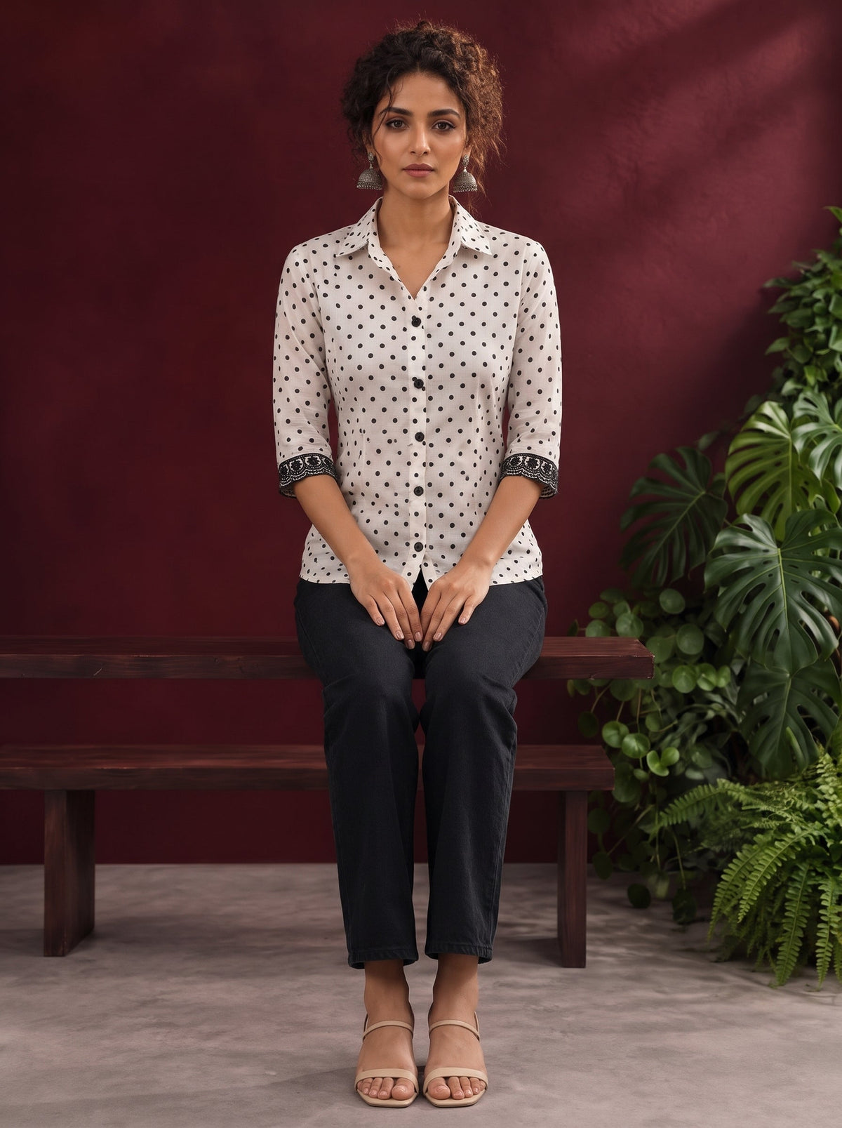Classic White Cotton Shirt with Black Polka Dot Print and Contrast Lace Cuff Detail — seated