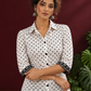 Classic White Cotton Shirt with Black Polka Dot Print and Contrast Lace Cuff Detail — styled view