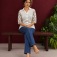 White Cotton Shirt with Contrast Grey Ikat Zigzag Print Sleeves — seated