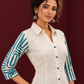 Classic Off-White Cotton Shirt with Teal Abstract Printed Sleeves and Collared Neckline — styled view