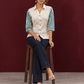 Classic Off-White Cotton Shirt with Teal Abstract Printed Sleeves and Collared Neckline — seated