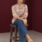 Ivory Cotton Floral Printed Shirt with Mandarin Collar and Lace-Trimmed Balloon Sleeves — seated