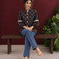 Classic Black Cotton Shirt with Ajrakh-Inspired Floral Block Print & Lace Inset Sleeves — seated