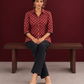 Classic Maroon Cotton Shirt with Ajrakh Print & Contrast Black Lace Trim Cuffs — seated