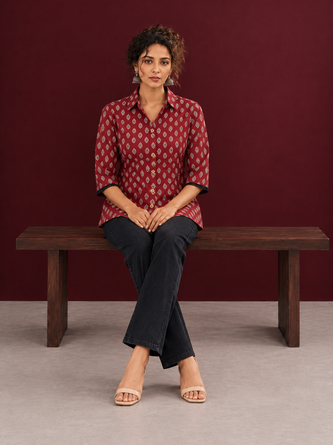 Classic Maroon Cotton Shirt with Ajrakh Print & Contrast Black Lace Trim Cuffs — seated