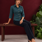 Timeless Teal Blue Cotton Shirt with Collared Neckline and Contrast Floral Buttons — seated