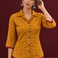 Mustard Bandhani Print Rayon Shirt with Contrast Maroon Hemline and Cuff Detailing — styled view