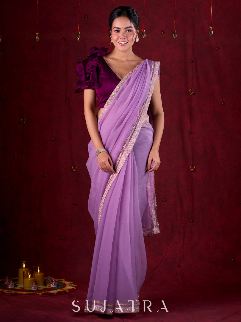 Soft Lavender Crepe Saree Adorned with Delicate Embroidered Lace Border