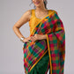 Festive plaid cotton saree in green, orange, and yellow tones