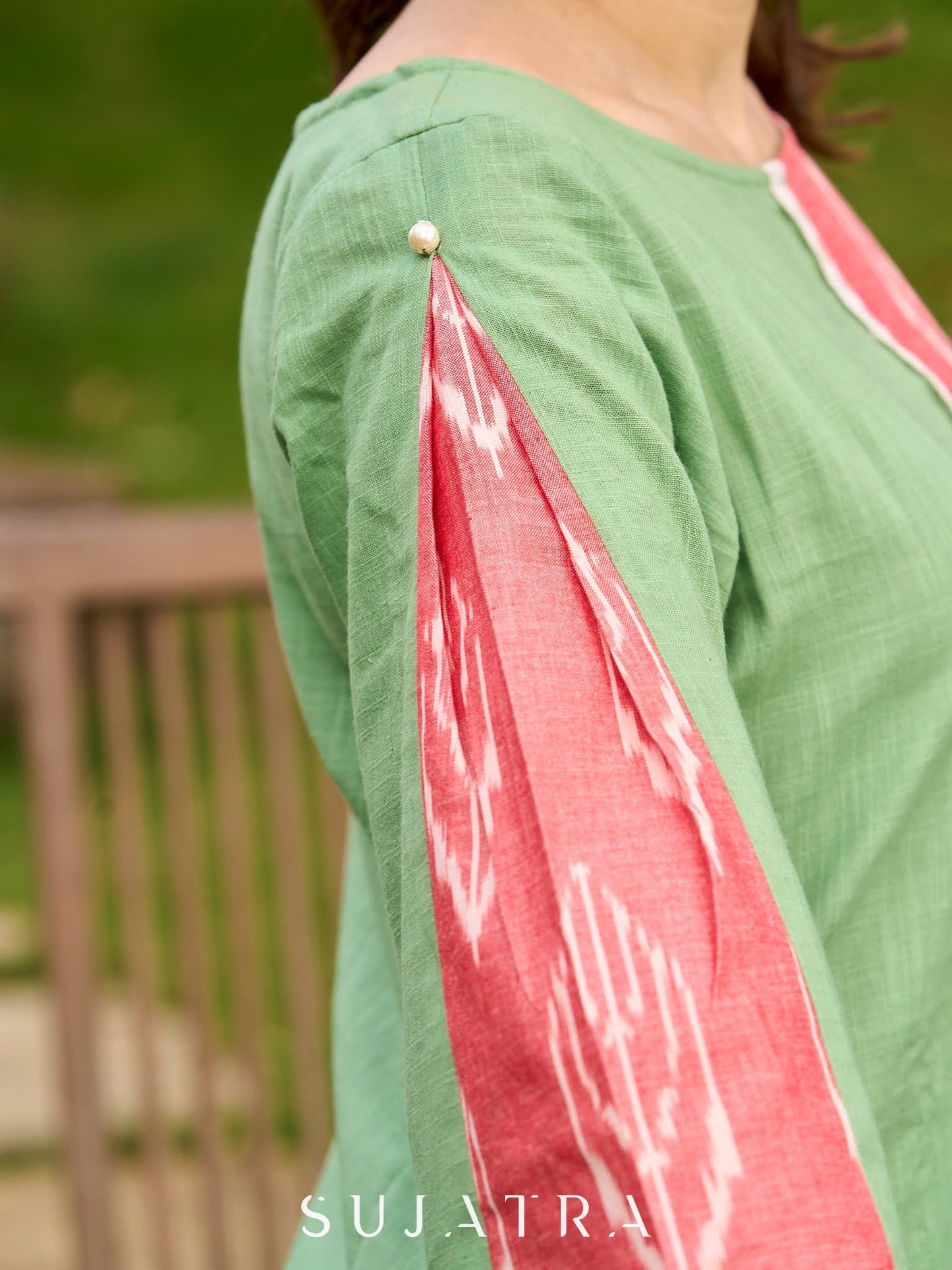 Subtle Pista Cotton Kurta featuring Asymmetric Peach Ikat Border Detailing