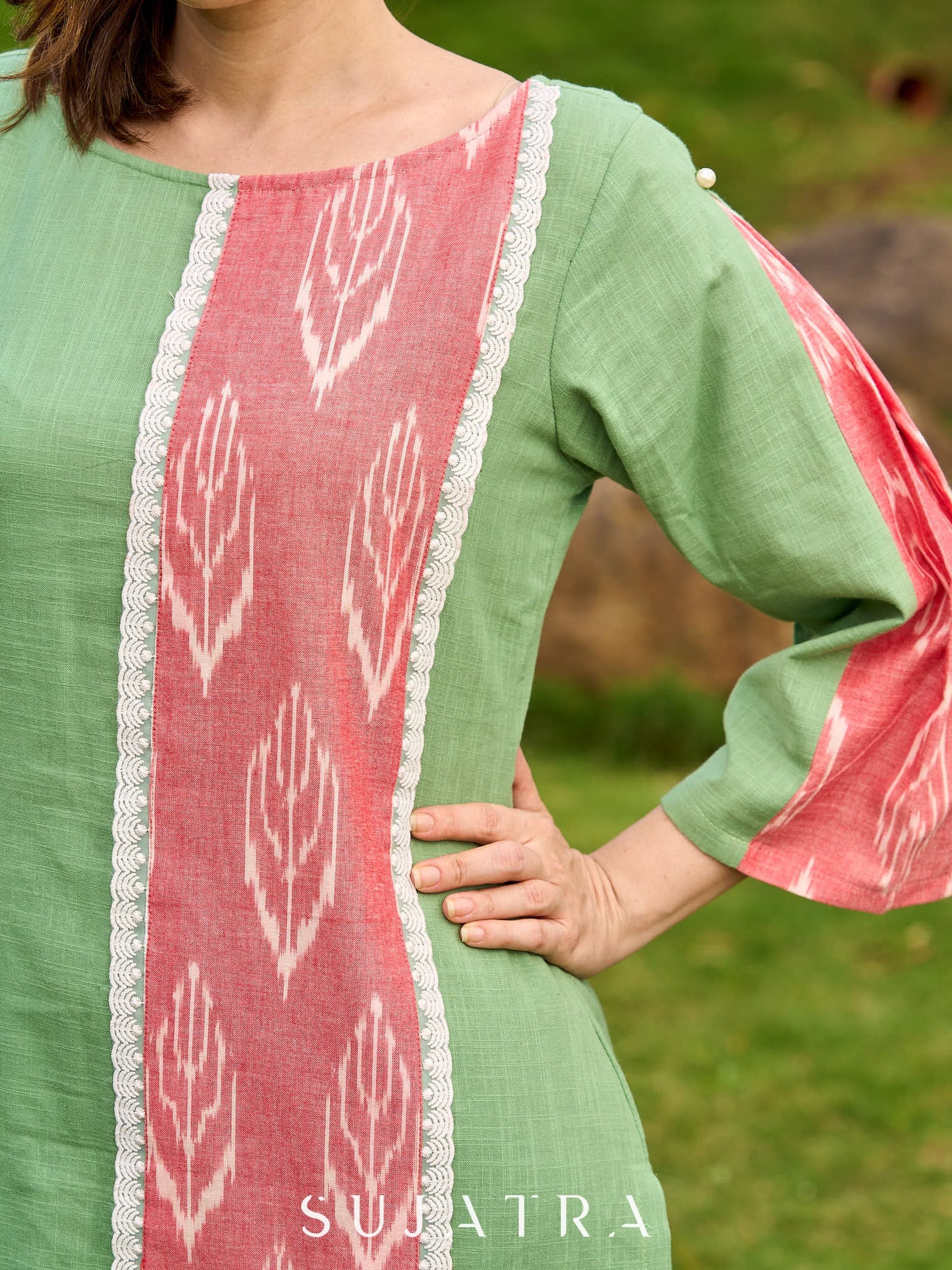 Subtle Pista Cotton Kurta featuring Asymmetric Peach Ikat Border Detailing