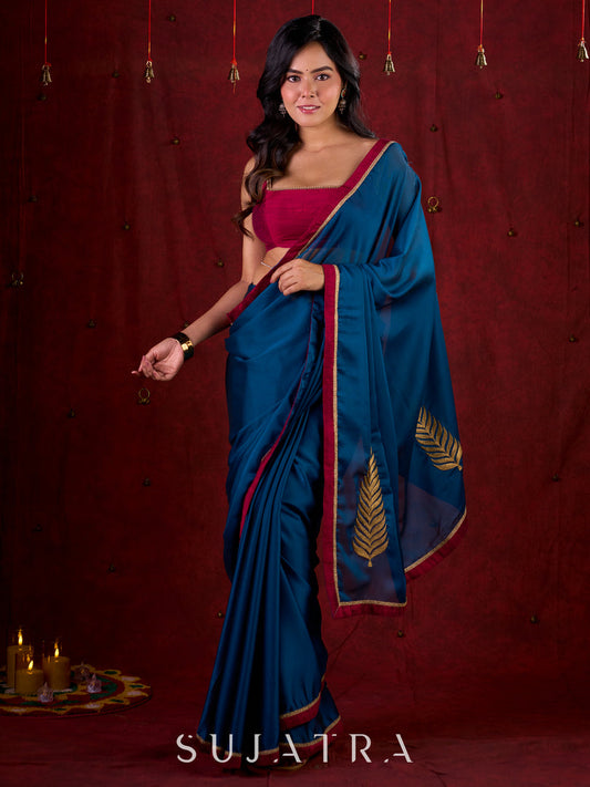 Deep Teal Silk Blend Saree Adorned with Magenta Border & Intricately Embroidered Pallu