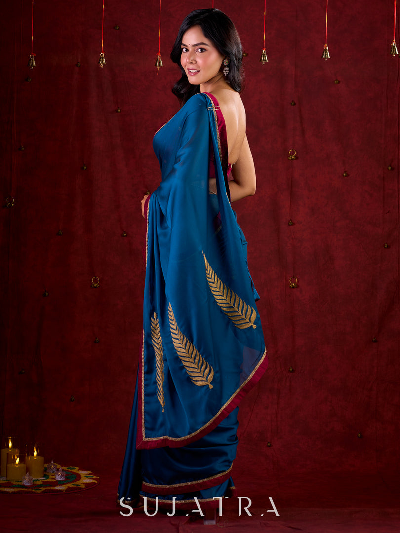 Deep Teal Silk Blend Saree Adorned with Magenta Border & Intricately Embroidered Pallu