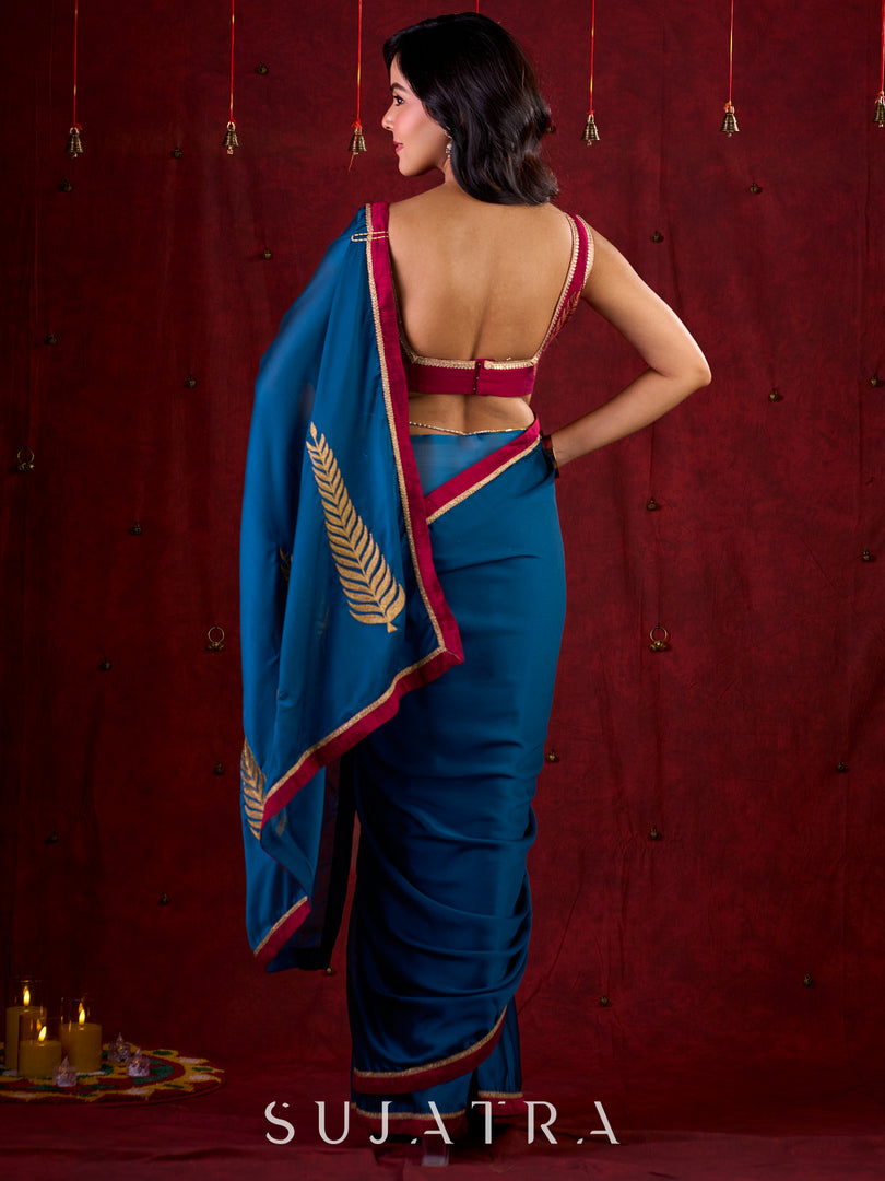 Deep Teal Silk Blend Saree Adorned with Magenta Border & Intricately Embroidered Pallu