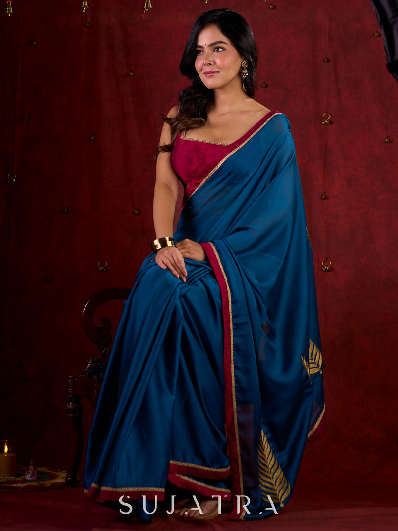 Deep Teal Silk Blend Saree Adorned with Magenta Border & Intricately Embroidered Pallu