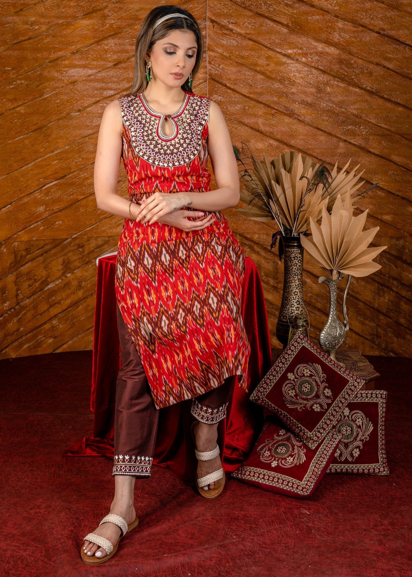 Exclusive sleeveless ikat kurta with heavy hand embroidery on neckline.