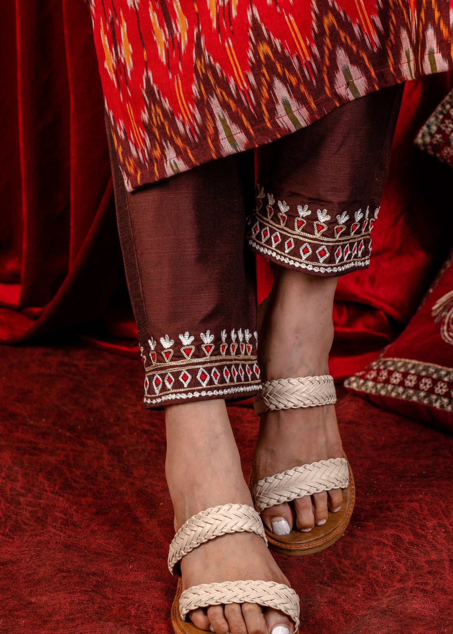 Exclusive sleeveless ikat kurta with heavy hand embroidery on neckline.