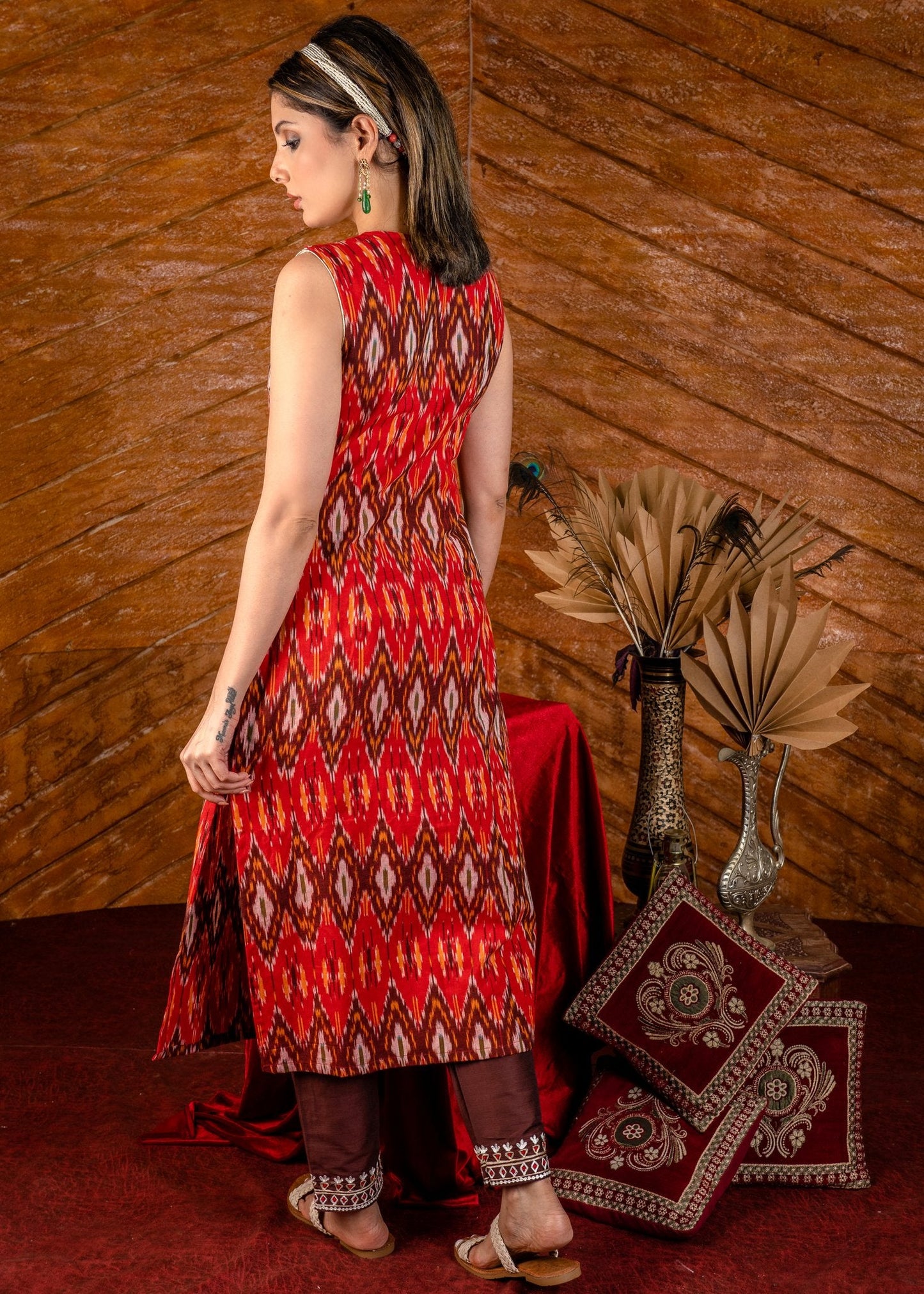 Exclusive sleeveless ikat kurta with heavy hand embroidery on neckline.