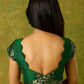 Festive dark green cap sleeve blouse with rich Banarasi combination