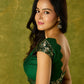 Festive dark green cap sleeve blouse with rich Banarasi combination