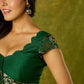 Festive dark green cap sleeve blouse with rich Banarasi combination