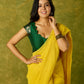Festive dark green cap sleeve blouse with rich Banarasi combination