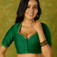 Gracefully hand embroidered forest green cotton silk blouse.