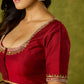 Festive hand embroidered maroon cotton silk blouse.