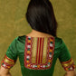 Elegant green khun blouse exuding festive flair and tradition.
