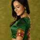 Elegant green khun blouse exuding festive flair and tradition.