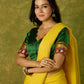 Elegant green khun blouse exuding festive flair and tradition.