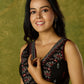 Beautiful black cotton sleeveless blouse with elegant fabric combination .