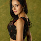 Beautiful black cotton sleeveless blouse with elegant fabric combination .