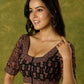 Artfully crafted cotton blouse with rich Ajrakh fabric accents.