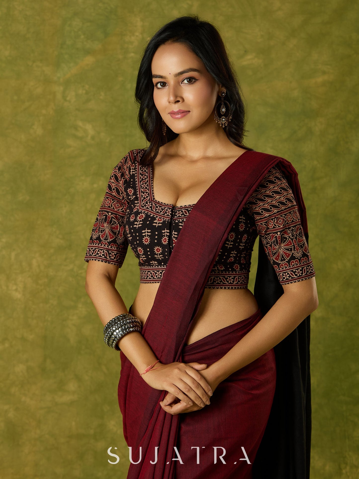 Artfully crafted cotton blouse with rich Ajrakh fabric accents.