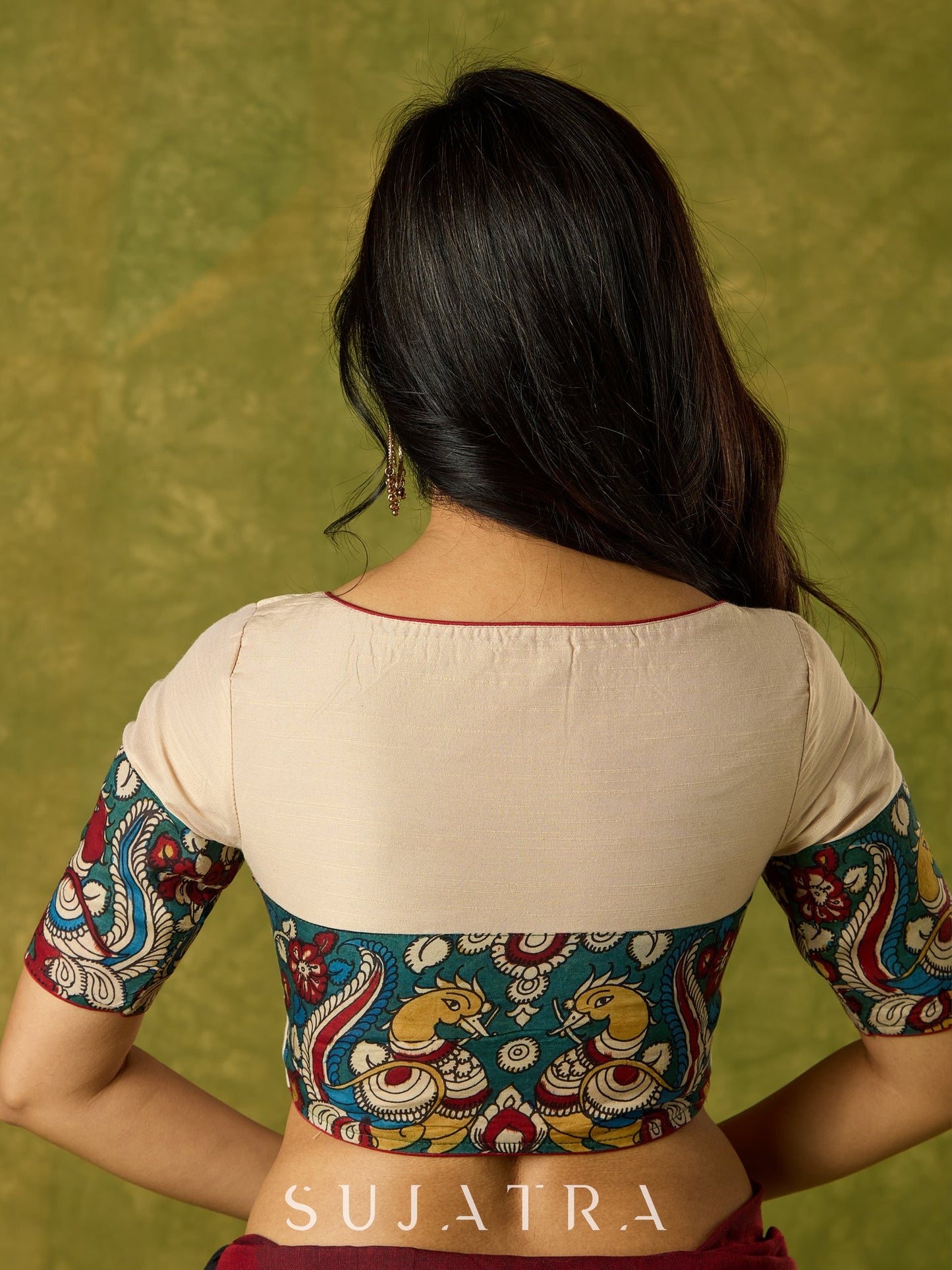 Beige cotton silk blouse beautifully blended with artistic kalamkari detailing.