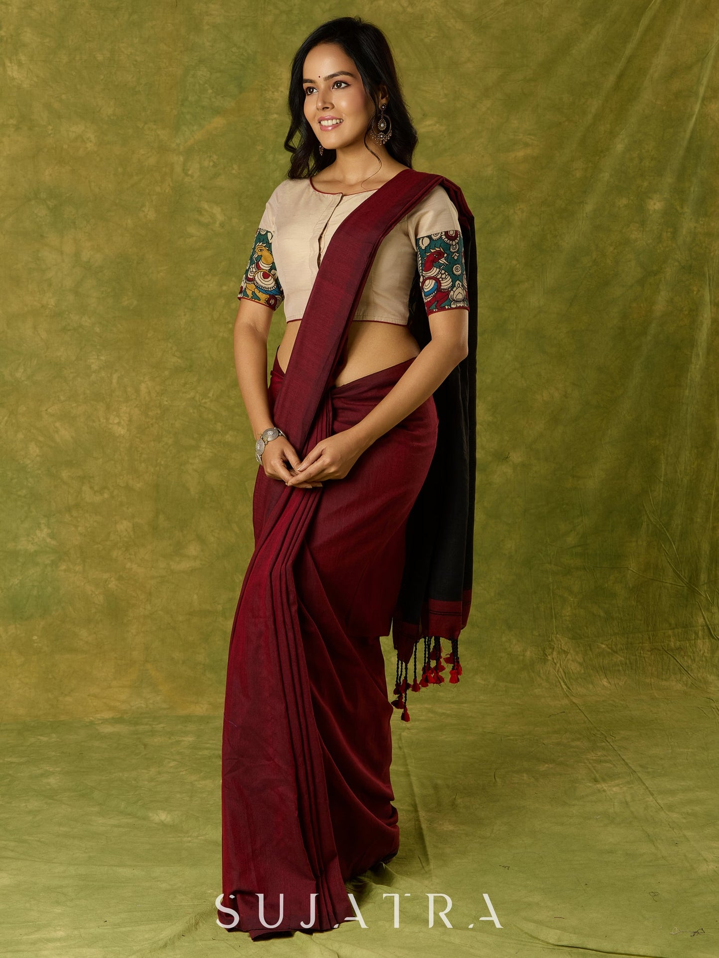 Beige cotton silk blouse beautifully blended with artistic kalamkari detailing.