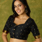 Festive charm in black self-butti cotton silk blouse.