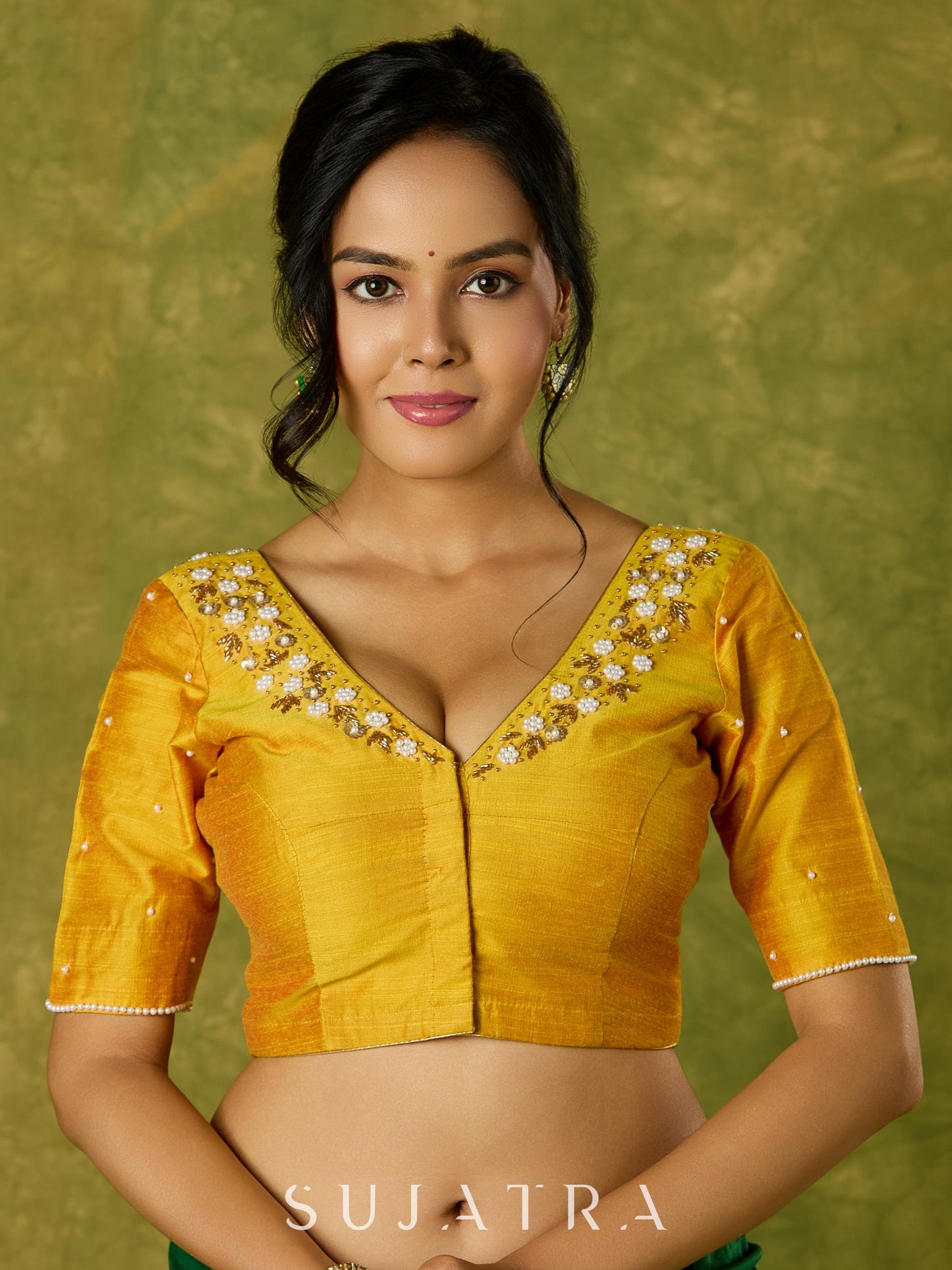 Beautifully hand embroidered light yellow cotton silk blouse for festivals.