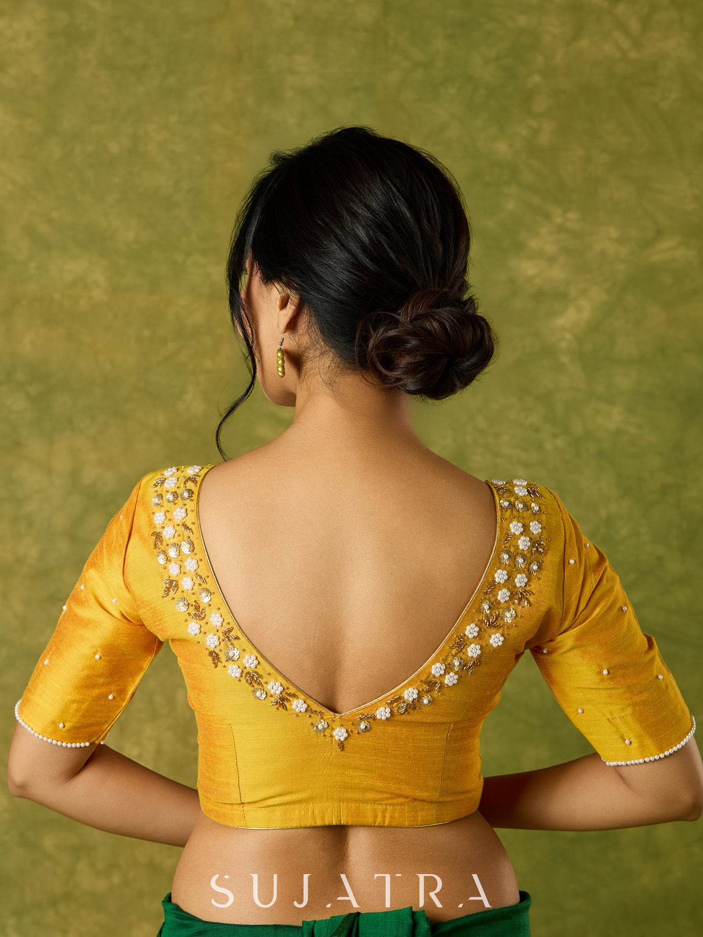 Beautifully hand embroidered light yellow cotton silk blouse for festivals.