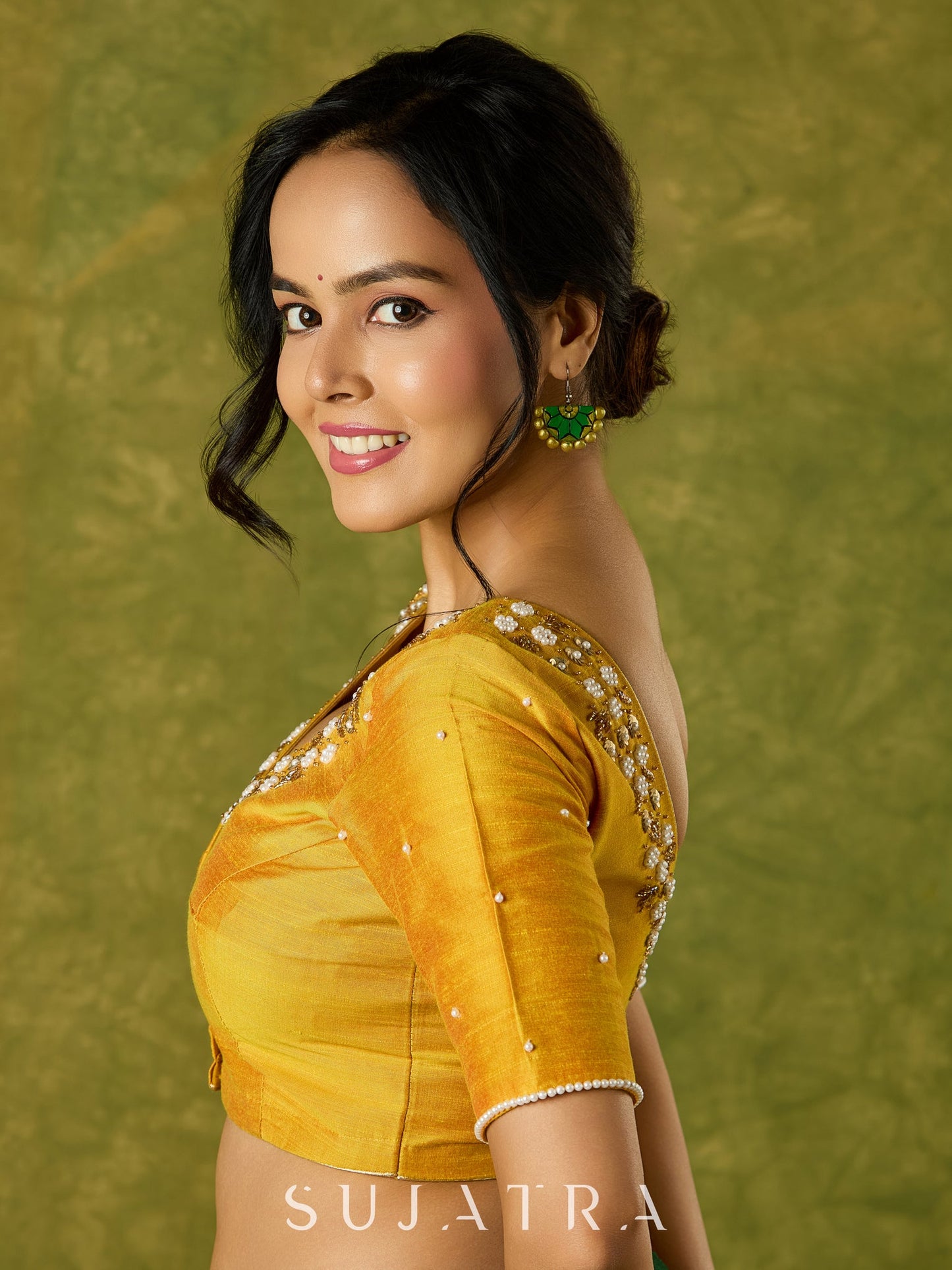 Beautifully hand embroidered light yellow cotton silk blouse for festivals.