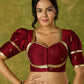 Exquisite maroon butti cotton silk blouse with rich festive appeal.