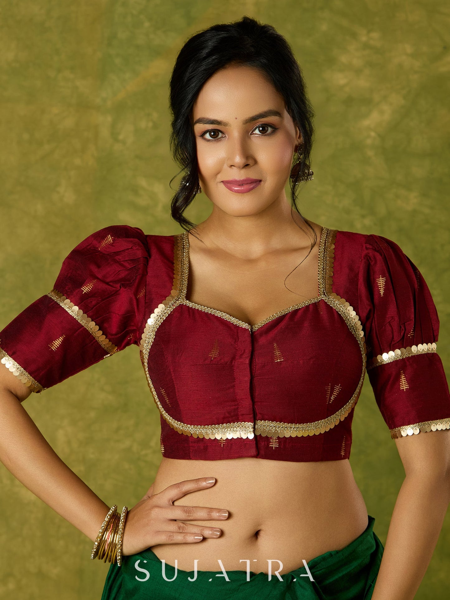 Exquisite maroon butti cotton silk blouse with rich festive appeal.